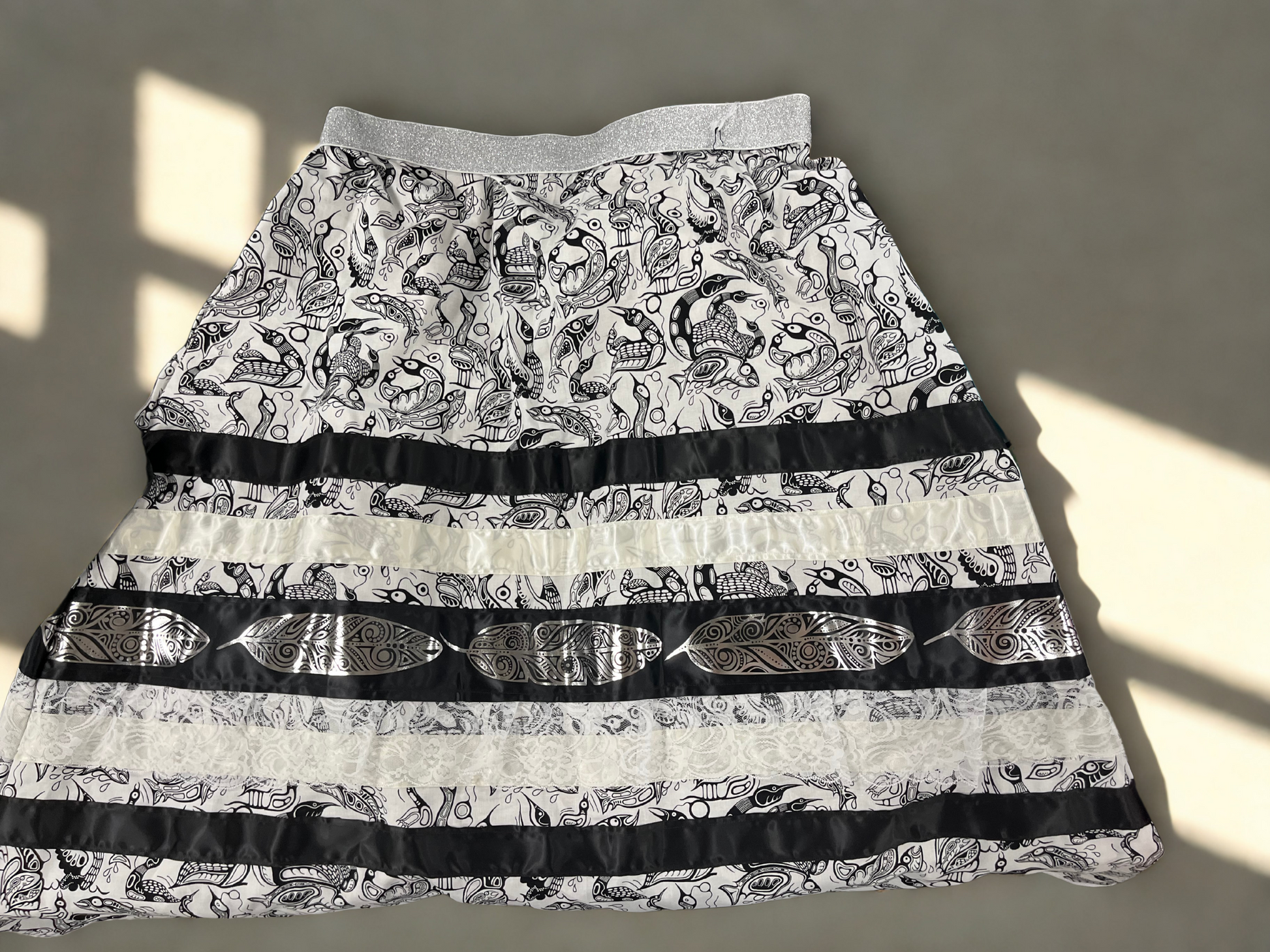 Skirt with black and white pattern on a neutral background